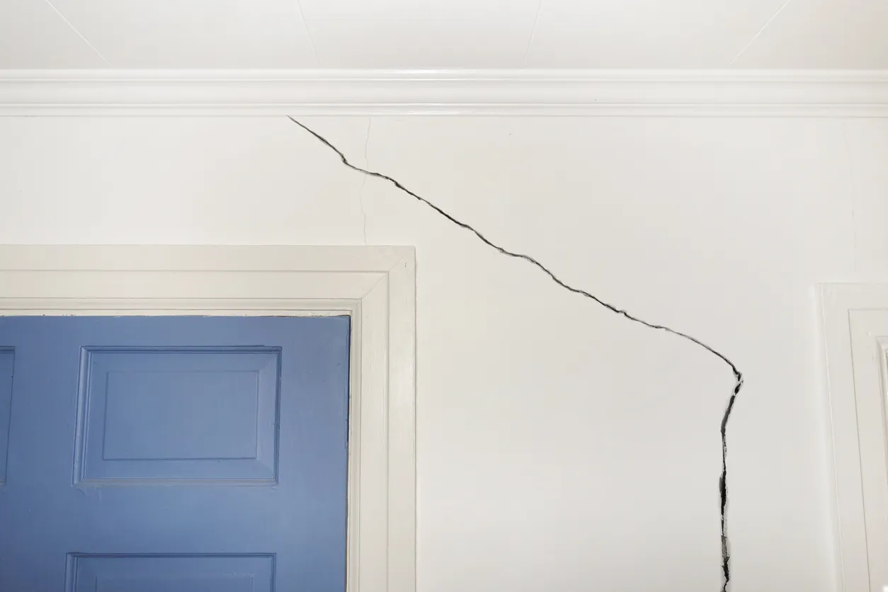cracked drywall in a hallway