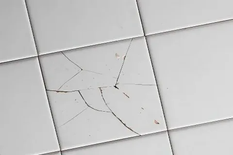 cracked bathroom tile in Miami home